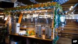 The food distribution station of Berlin's biggest restaurant Hofbraeu Berlin is ready for homeless people, in Berlin, Germany, Thursday, Dec. 17, 2020. (AP Photo/Markus Schreiber)
