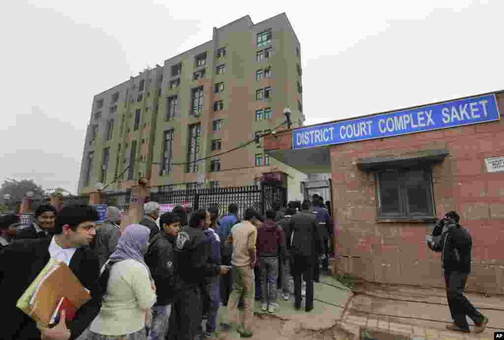 Indians stand in a line to enter the District Court complex where a new fast-track court was inaugurated Wednesday to deal specifically with crimes against women, in New Delhi, India, January 3, 2013.