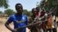 A picture taken on March 6, 2014 shows members of the Chritisian militant group Revolution of Justice (RJ) arriving in the village Nanga Boguila between Bossangoa and Bozoum. 
