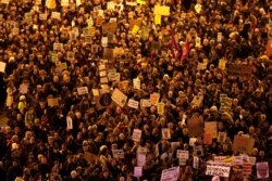 Demonstrators march to demand world leaders take real action against climate change, during a protest in Madrid, Dec. 6, 2019.