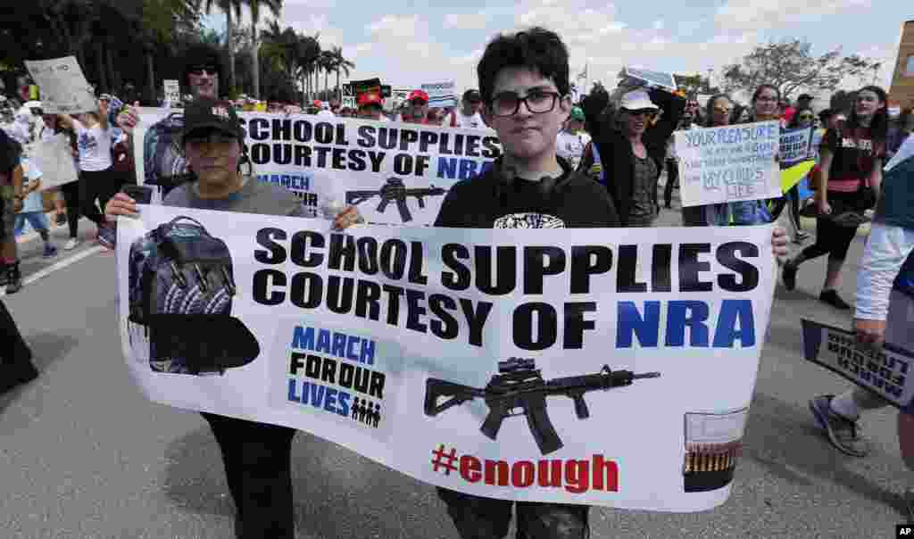 People take part in a &quot;March For Our Lives&quot; rally Saturday, March 24, 2018, in Parkland, Fla.