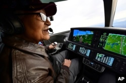 FILE- Retired US Air Force Col. Charles McGee flies a Cirrus SF50 Vision Jet during a round trip flight from Frederick, Maryland, to Dover Air Force Base in Delaware on. Dec. 6, 2019.
