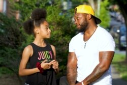 Thamar Davis has been in Riley Davis's life since she was a toddler. (Saqib Ul Islam/VOA)