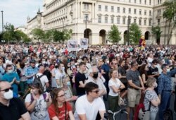FILE - Demonstrators protest against the planned Chinese Fudan University campus in Budapest, Hungary, June 5, 2021.