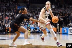Dorka Juhasz could be making money if she still lived in Hungary. However, she is playing college basketball for the University of Connecticut. (AP Photo/Jessica Hill)