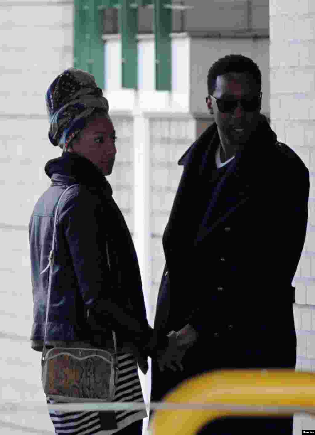 Ndaba Mandela (R), one of former South African President Nelson Mandela&#39;s grandsons, and an unidentified companion leave the Mediclinic Heart Hospital, where the former president is being treated, in Pretoria, July 5, 2013.&nbsp;