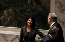 FILE - Then-U.S. Ambassador to the United Nations Nikki Haley speaks with Ukraine's envoy to the U.N. Volodymyr Yelchenko before a Security Council meeting at U.N. headquarters, in New York, Feb. 28, 2017.