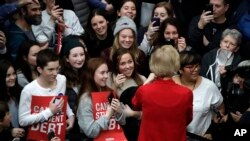 Democratic presidential candidate Elizabeth Warren speaks to an overflow crowd at a Get Out the Caucus Rally, at Simpson College, in Indianola, Iowa, Feb. 2, 2020.
