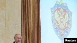 FILE - Russian President Vladimir Putin delivers a speech during a session of the Federal Security Service (FSB) board in Moscow, March 6, 2019. 