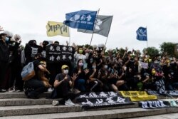 People gather for a rally to mark the second anniversary of the protests in Hong Kong, in Union Square in New York City, June 12, 2021.