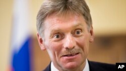 FILE - President Vladimir Putin’s spokesman Dmitry Peskov speaks to The Associated Press in Moscow.
