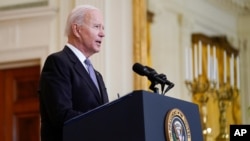 FILE - President Joe Biden speaks about the distribution of COVID-19 vaccines, in the East Room of the White House in Washington, May 17, 2021.