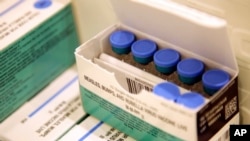 FILE -- Measles, mumps and rubella vaccines sit in a cooler at the Rockland County Health Department in Pomona, N.Y., March 27, 2019. 