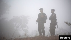 FILE - Fighters opposing Myanmar's military are seen in Kaw Thoo Lei, Kayin state, Myanmar, Jan. 31, 2019. Myanmar's army battled local militia fighters Saturday in the northwestern town of Mindat.