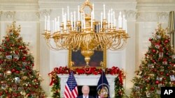 President Joe Biden speaks about the COVID-19 response and vaccinations, in the State Dining Room of the White House in Washington, Dec. 21, 2021. 