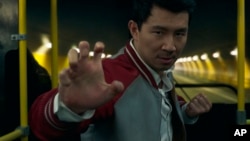 This image released by Marvel Studios shows Simu Liu in a scene from 'Shang-Chi and the Legend of the Ten Rings.' (Marvel Studios via AP)