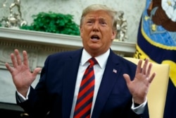 FILE - President Donald Trump speaks during a meeting with Australian Prime Minister Scott Morrison in the Oval Office of the White House, Sept. 20, 2019, Washington.