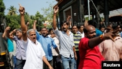 Protesters shout slogans as they take part in a rally called by various Hindu organizations after two women entered the Sabarimala temple in Kochi, India, Jan. 2, 2019.