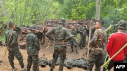 FILE - Trainees take part in military exercises with the Karen National Union (KNU) Brigade 6, an armed rebel group in eastern Karen state on May 9, 2021, amid a heightened conflict with Myanmar's military following the February coup.