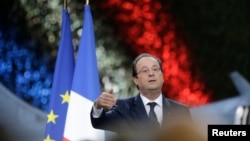 French President Francois Hollande presents his New Year wishes to the French Army after visiting special forces troops at Creil military airbase in Creil, near Paris, Jan. 8, 2014.