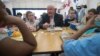Agriculture Secretary Sonny Perdue eats lunch with students at the Catoctin Elementary School in Leesburg, Virginia, May 1, 2017. Perdue unveiled a new rule on school lunches as the Trump administration and other Republicans press for flexibility after eight years of the emphasis on healthy eating. 