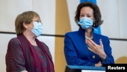 U.N. High Commissioner for Human Rights Michelle Bachelet speaks with the President of the Human Rights Council Elisabeth Tichy-Fisslberger during the 45th session of the Human Rights Council, at the European U.N. headquarters in Geneva, Sept. 14, 2020. 