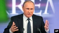Russian President Vladimir Putin speaks during his annual news conference in Moscow, Russia, Dec. 17, 2015. 