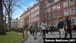 Students walk between classes on campus Brooklyn College, one of New York's public institutions, for which the Excelsior Scholarship covers tuition costs.
