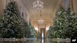 The Cross Hall are decorated with "The Nutcracker Suite" theme is seen during a media preview of the 2017 holiday decorations at the White House in Washington, Monday, Nov. 27, 2017. (AP Photo/Carolyn Kaster)