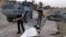 Iraqi security forces and tribal fighters regain control of northern neighborhoods after overnight heavy clashes with Islamic State militants in Ramadi, April 23, 2015. 