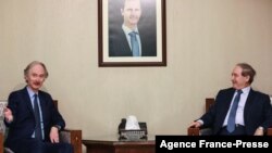 Syrian Foreign Minister Faisal Miqdad (R) receives the United Nations Special Envoy for Syria Geir Pedersen (L) in the capital Damascus, Dec. 12,2021. 