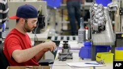 FILE - Anthony Zingale wires blender motors at the Vitamix manufacturing facility in Strongsville, Ohio. The U.S. Labor Department reported an August unemployment rate of 5.1 percent, the lowest in more than seven years.
