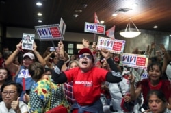 FILE - Supporters of the Pheu Thai party react to unofficial results of the general election in Bangkok, Thailand, March 24, 2019. Pheu Thai emerged as the largest party and formed alliances yet was unable to form a government.