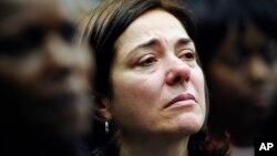 Francine Wheeler, mother of Sandy Hook Elementary School shooting victim Benjamin Wheeler, cries as she listens to Vice President Joe Biden speak during a gun violence conference in Danbury, Conn., Feb. 21, 2013.