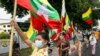 Military supporters wave Myanmar national flags during a protest to demand an inquiry to investigate the Union Election Commission (UEC) in Yangon on Jan. 29, 2021, as fears swirl about a possible coup by the military over electoral fraud concerns.