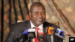 FILE - South Sudan rebel leader Riek Machar addresses journalists during a news conference in Nairobi, Kenya, July 8, 2015. 