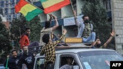 Des Éthiopiens célèbrent le remplissage du Grand barrage éthiopien de la Renaissance (GERD), à Addis-Abeba, en Ethiopie, le 2 août 2020. (Photo AFP)