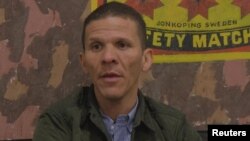 FILE PHOTO: Venezuelan opposition lawmaker Gilber Caro speaks during an interview with Reuters in Caracas, Venezuela June 12, 2018 in this still image taken from a video.