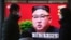 People walk by a TV screen showing North Korean leader Kim Jong Un during a ruling party congress, at the Seoul Railway Station in Seoul, South Korea, Wednesday, Jan. 6, 2021. Kim opened his country's first ruling party congress in five years with…