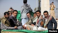 FILE PHOTO: Armed Houthi followers leave after a funeral for Houthi fighters killed in fighting against government forces in Yemen's oil-rich province of Marib, Feb. 20, 2021.
