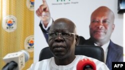 Palestinian protesters run amid the smoke during clashes with Israeli forces near the border with Israel east of Gaza city on February 9, 2018. 