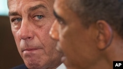 FILE - House Speaker John Boehner (L) and President Barack Obama