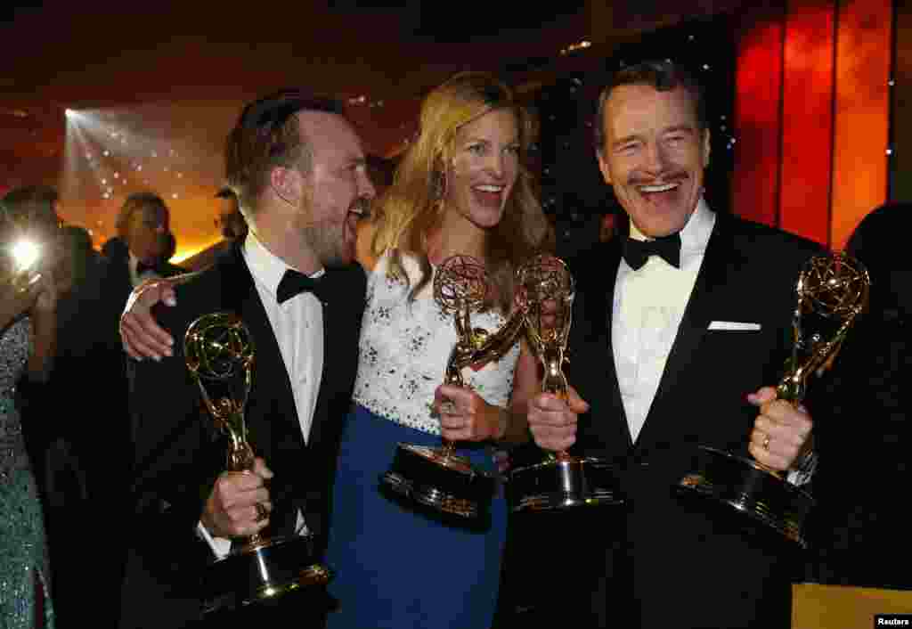 Aaron Paul, winner for Outstanding Supporting Actor in a Drama Series, Anna Gunn, winner for Outstanding Supporting Actress in a Drama Series and Bryan Cranston, winner for Outstanding Lead Actor in a Drama Series, pose with their awards for AMC's "Breaki