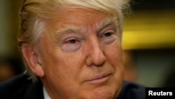 President Donald Trump listens during a meeting with teachers and parents on education at the White House in Washington, Feb. 14, 2017.