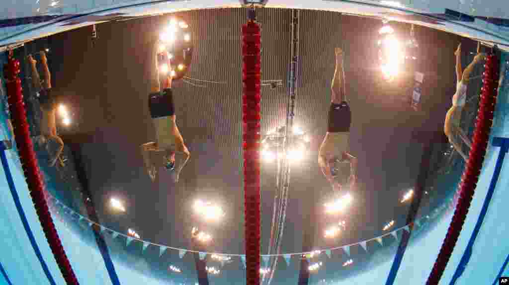 Michael Phelps, left, and Ryan Lochte, both from the U.S., start in the men&#39;s 200-meter individual medley swimming final.