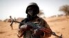 FILE - A Malian soldier patrols in Mali, Oct. 20, 2017.
