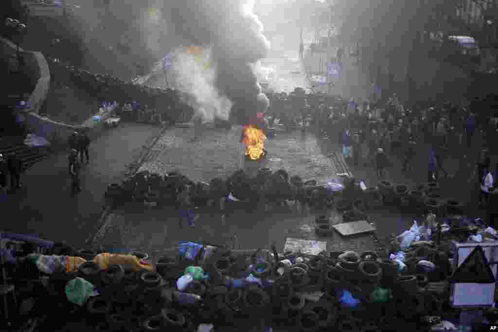 A fire burns at the barricades on the outskirts of Independence Square in Kyiv, Feb. 21, 2014.