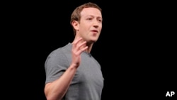 Facebook CEO Mark Zuckerberg gestures during the Samsung Galaxy Unpacked 2016 event on the eve of this week’s Mobile World Congress wireless show, in Barcelona, Spain, Feb. 21, 2016. 