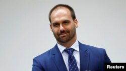 FILE - Brazilian Federal Deputy Eduardo Bolsonaro attends an International Seminar of Brazilian Foreign Policy in Brasilia, Brazil, Nov. 21, 2019.