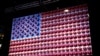 The Super Bowl is the most-watched American sporting event of the year. This American flag has been decorated with Wilson footballs, the company that manufactures every football that is used by the NFL. (B. Allen/VOA)